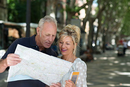 Happy couple looking at a map.