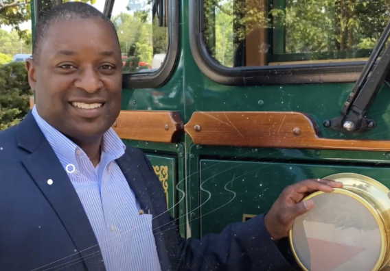 Golden Limo CEO Sean Duval standing outside the front of the Golden Trolley.