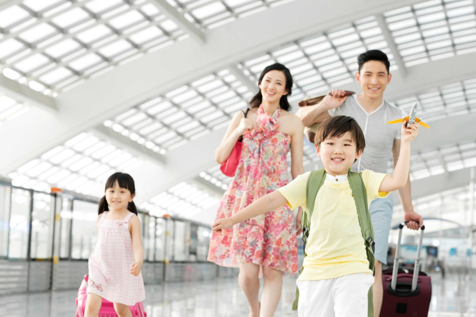 Happy family with luggage at the airport Happy family arrived to the DTW airport safely via black car service