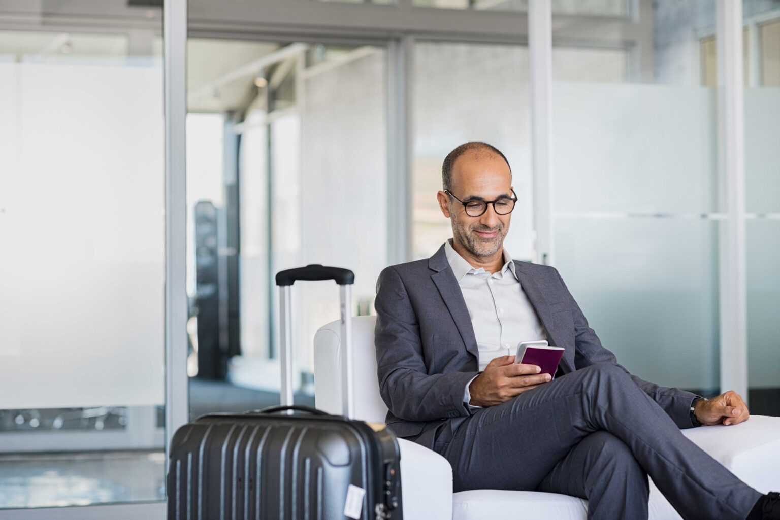 Mature businessman at airport Mature businessman at airport - black car service DTW
