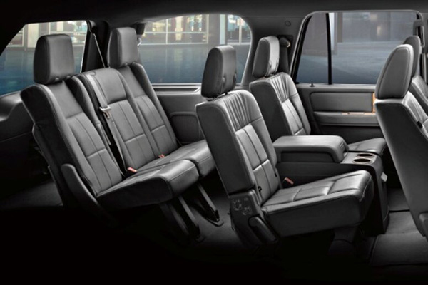 Interior image of a Golden Limo SUV with black leather seats