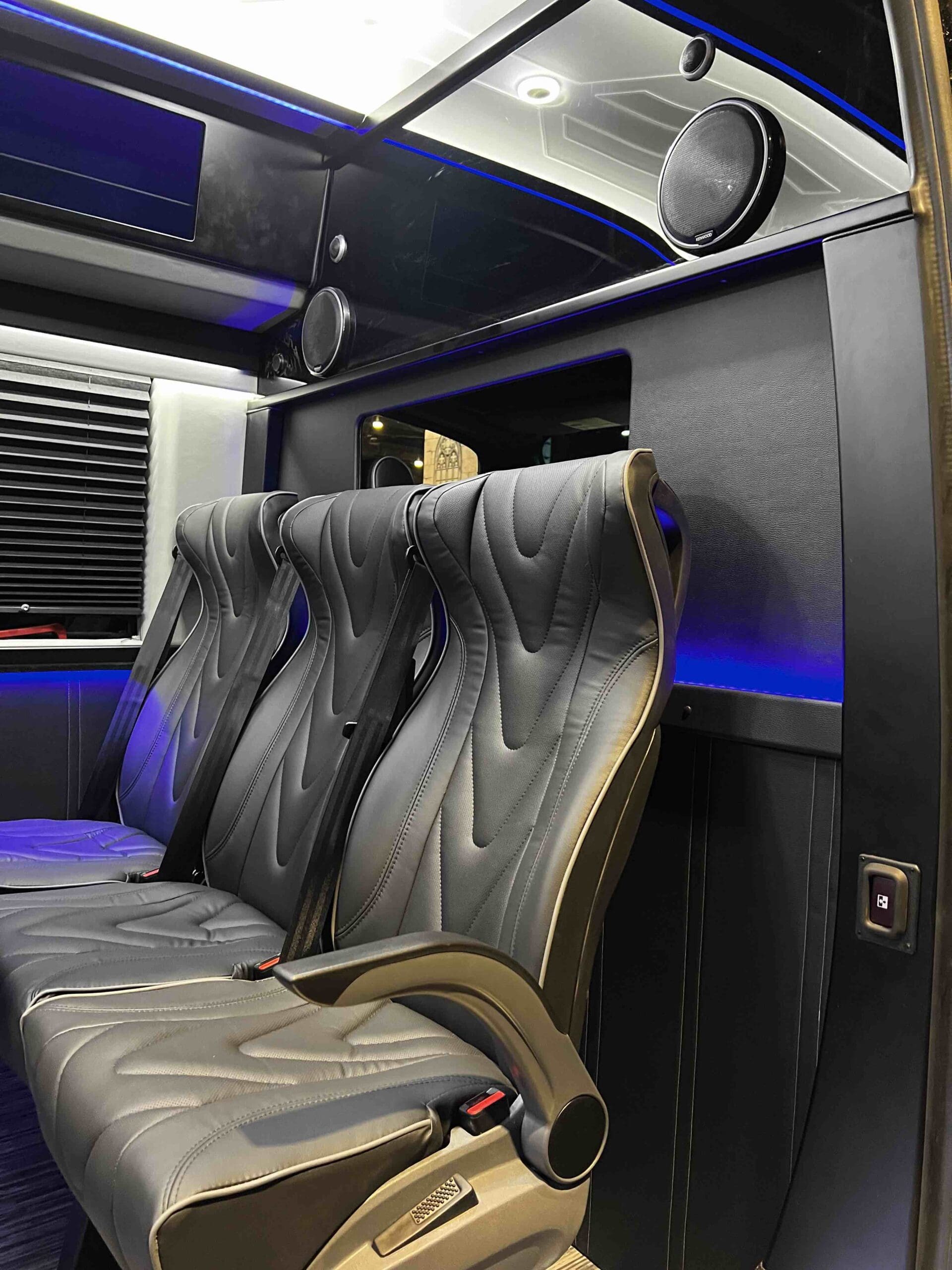 Golden Limo Executive Sprinter Shuttle, interior view showing front row of luxury seating in passenger area of vehicle