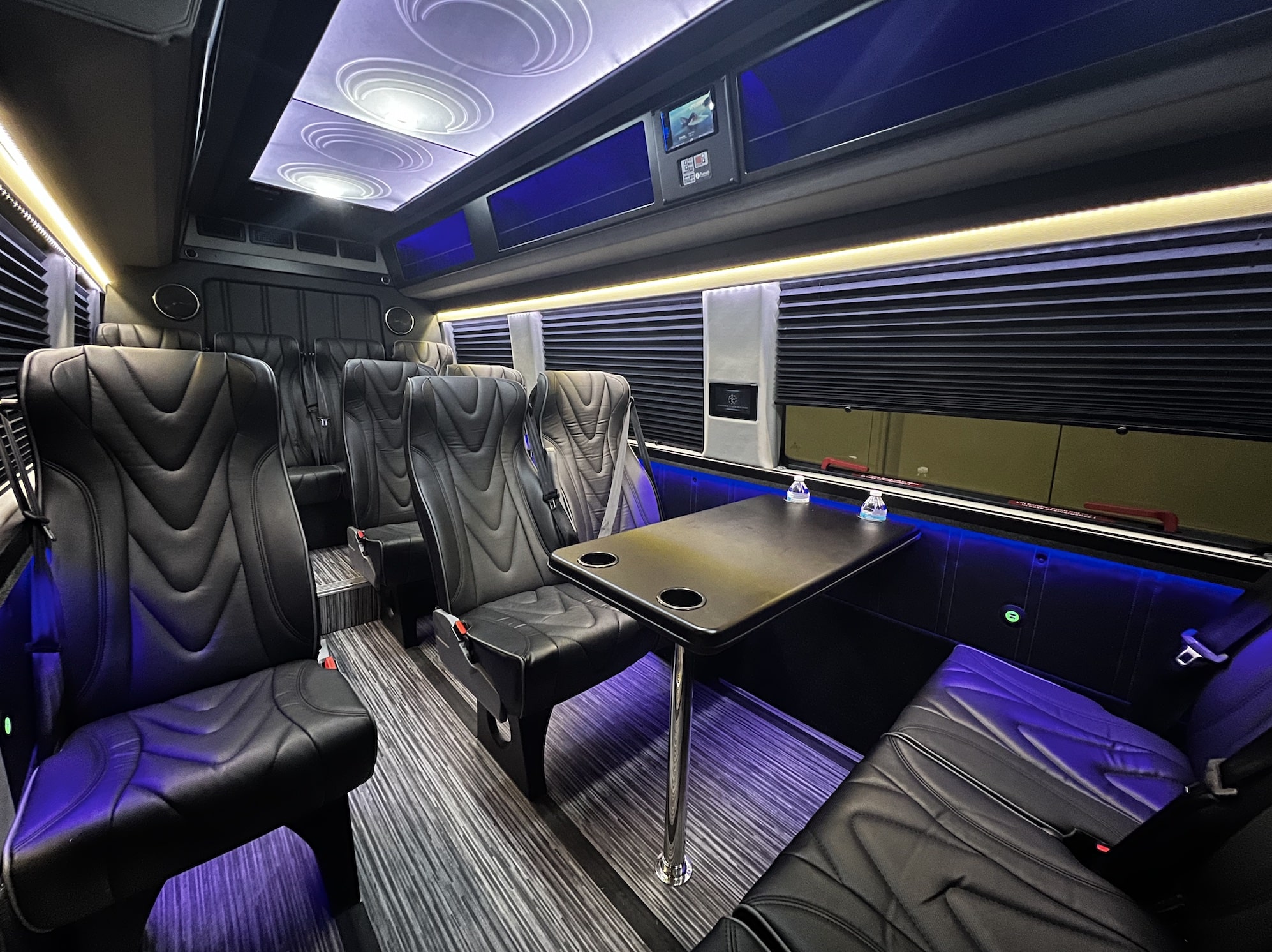 Golden Limo Executive Sprinter Shuttle, interior view with view of conference table seating and large windows