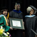 Golden Limo President & CEO Sean Duval receives an honorary Community Service Degree from Washtenaw Community College during the Spring 2024 graduation ceremony.