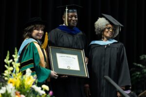 Golden Limo President & CEO Sean Duval receives an honorary Community Service Degree from Washtenaw Community College during the Spring 2024 graduation ceremony.
