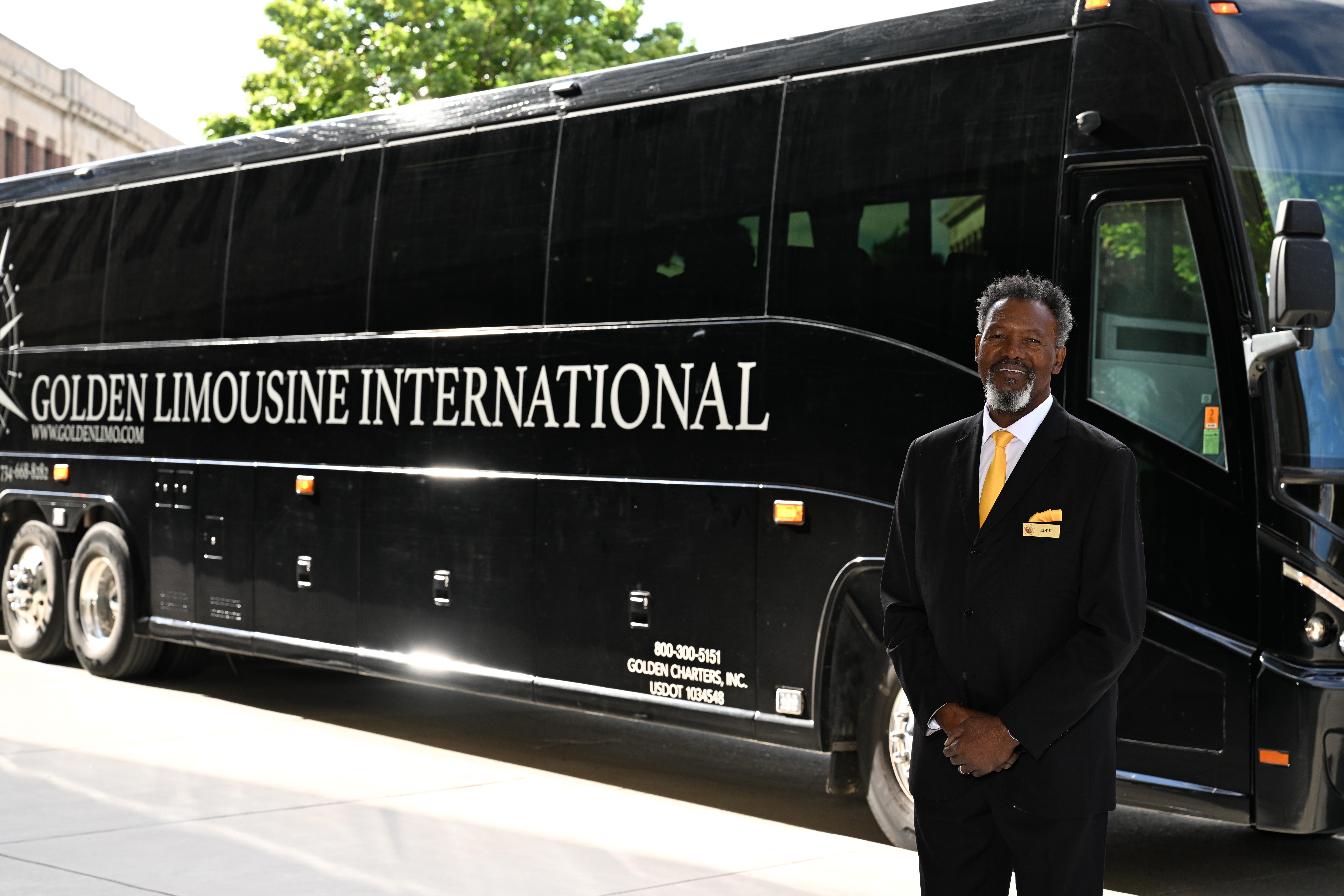 2024_06_GLI_Black Charter Bus Eddie Oldest Chauffeur_1619 Chauffeur Eddie with Black Charter Bus