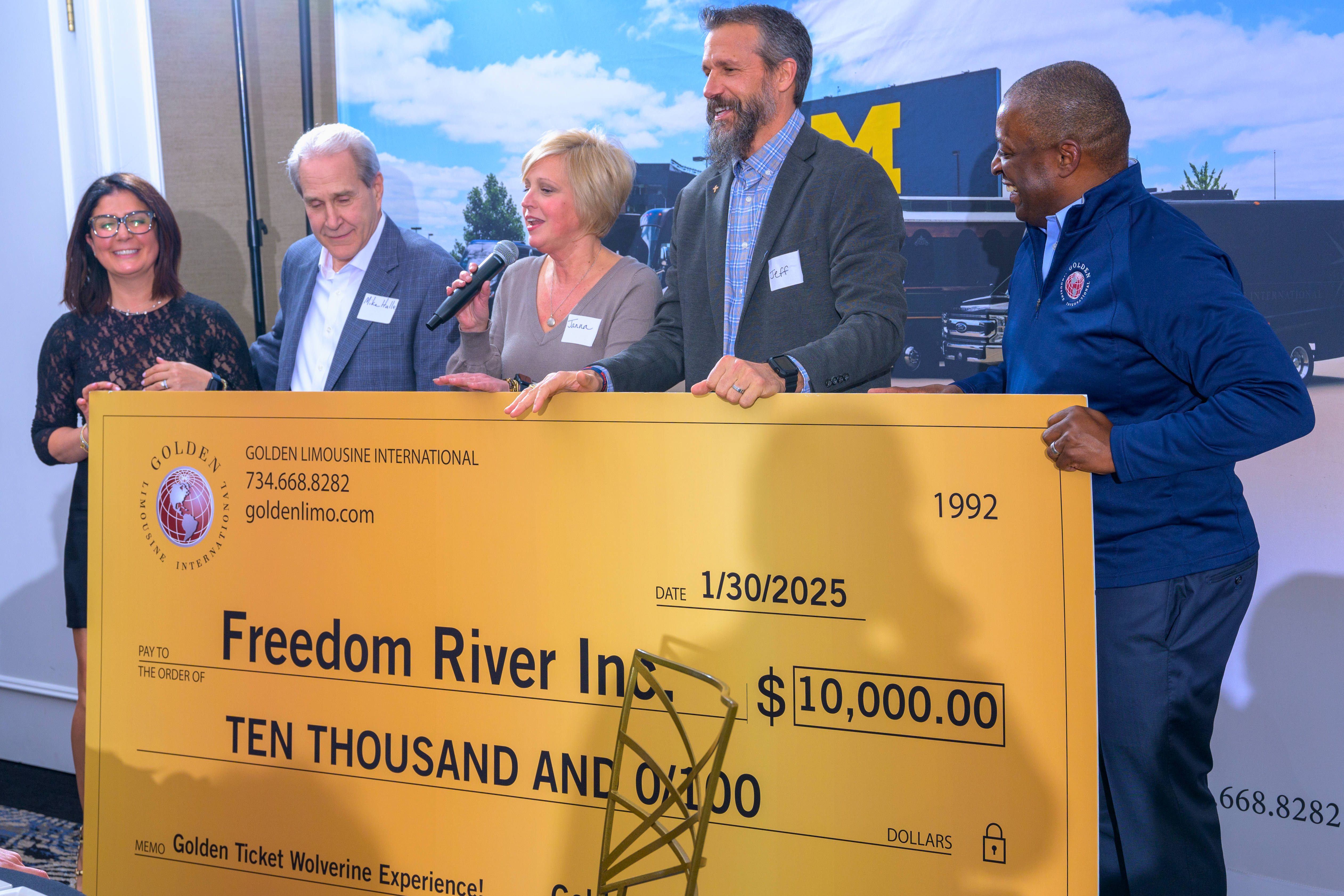 Golden Limousine International donates $10,000 to Freedom River at the Golden Ticket Wolverine Experience 2025.