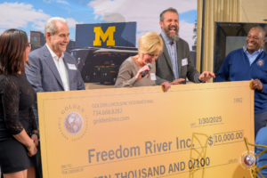 Golden Limousine International donates $10,000 to Freedom River at the Golden Ticket Wolverine Experience 2025.