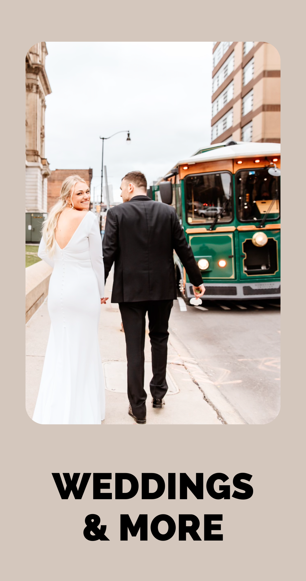 Wedding couple, bride and groom, laughing in front of Golden Trolley.