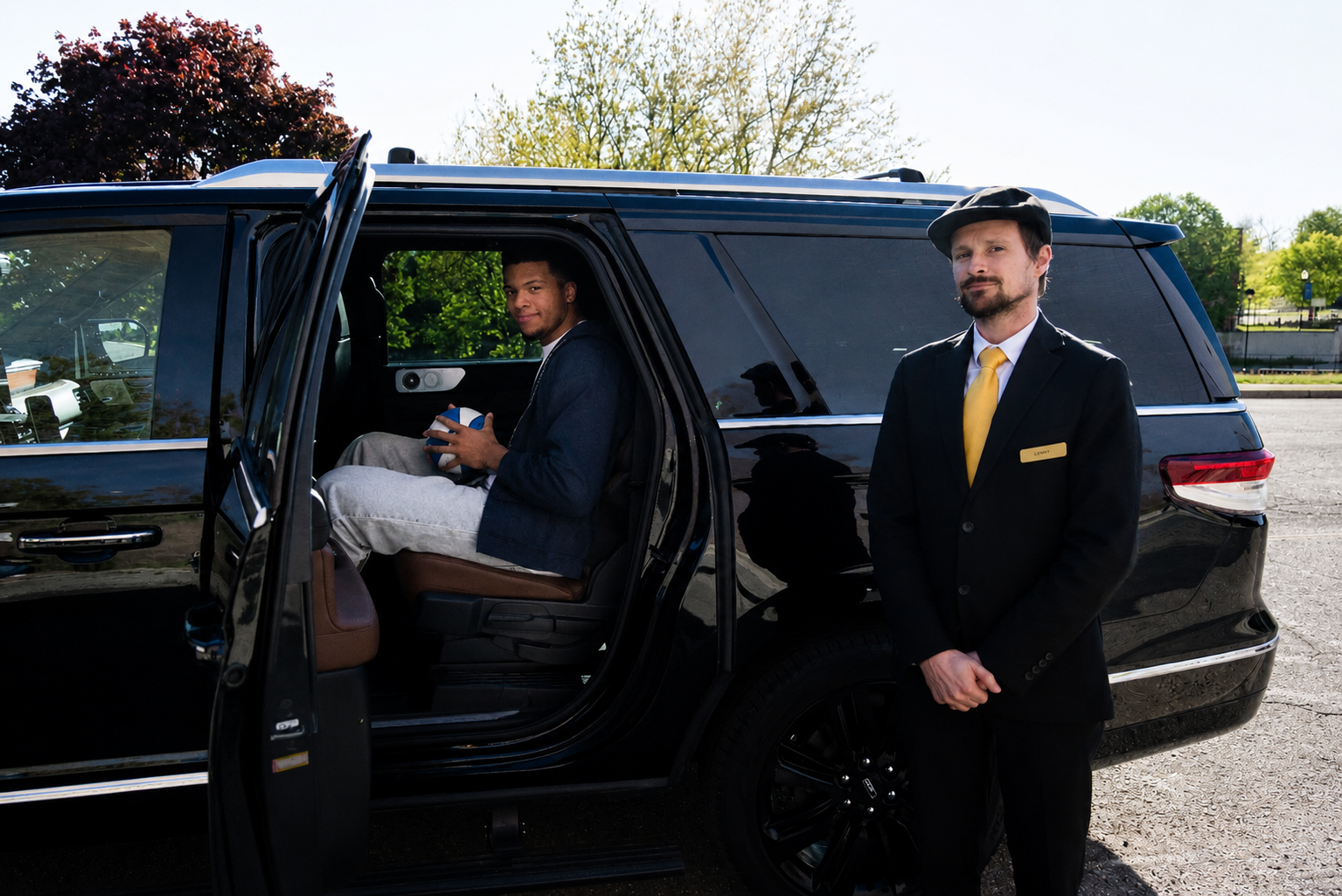 Golden Limousine International SUV with Trey Mckenney and Chauffuer.