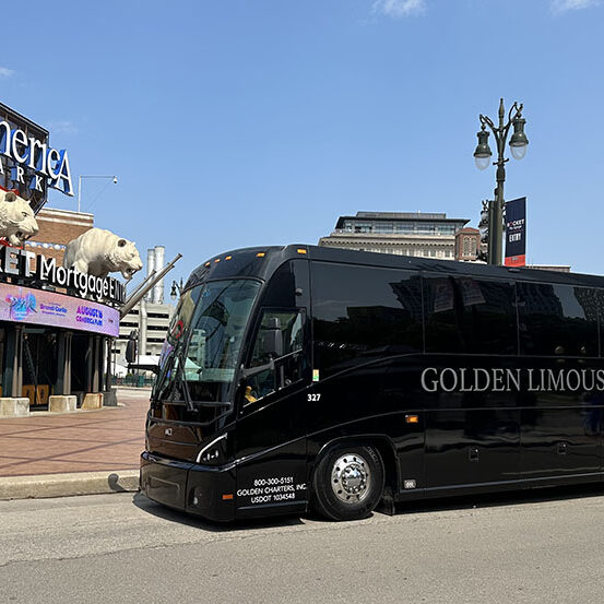 Golden Limousine Coach Bus sitting in front of Detroit Comerica Park