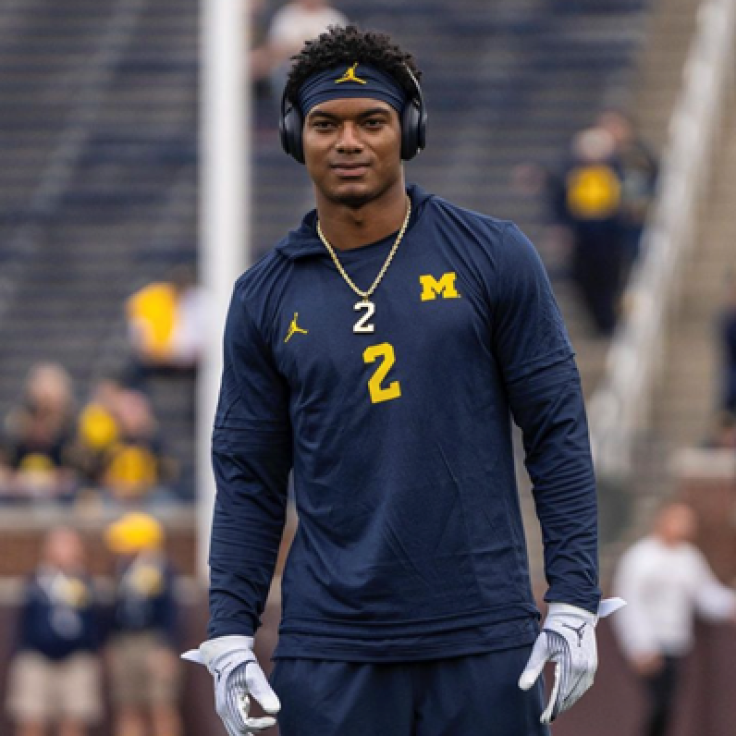 Golden Limo partner Will Johnson on the football field in warm up gear.