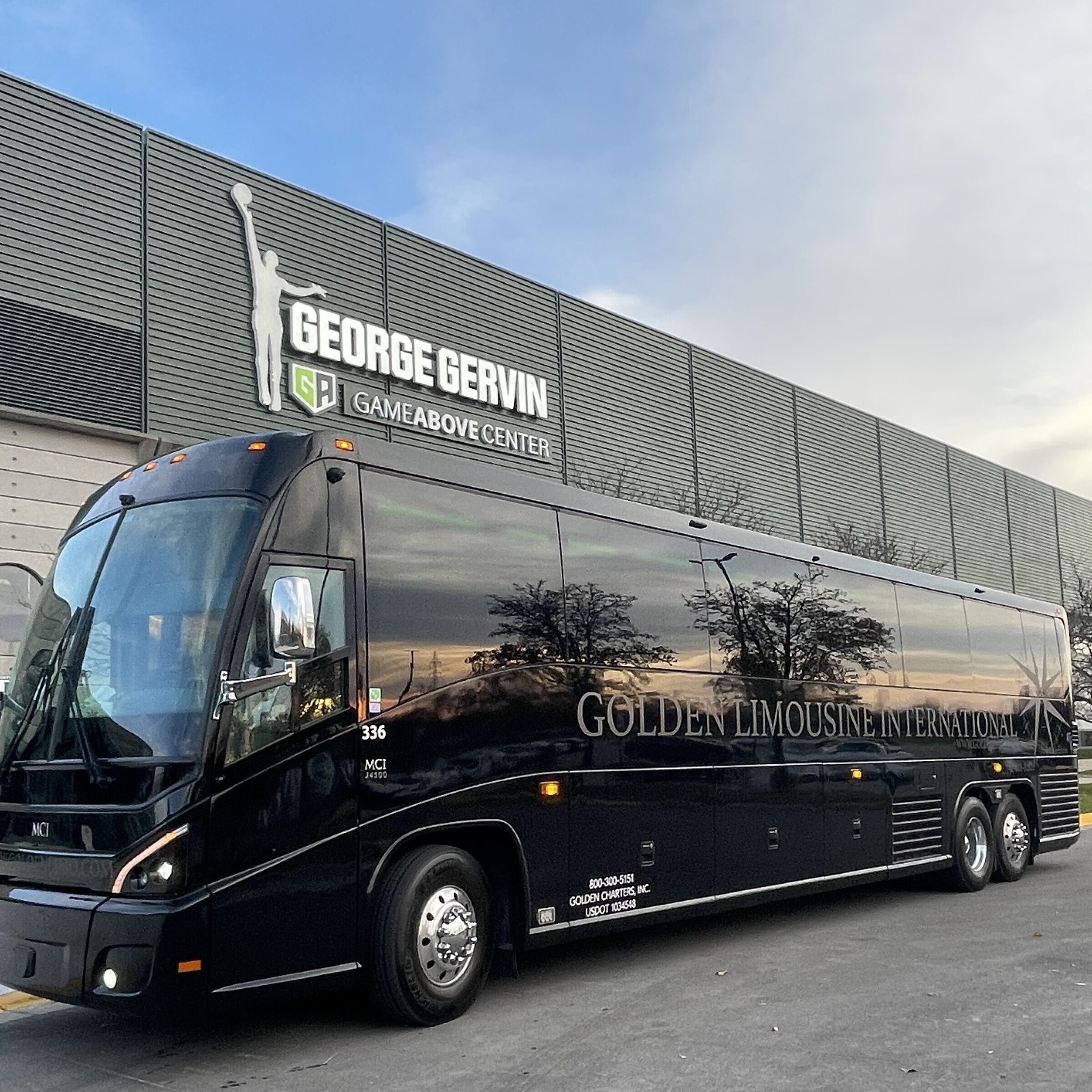 Exterior image of Golden Limo Charter Bus parked outside EMU'S George Gervin GameAbove Center